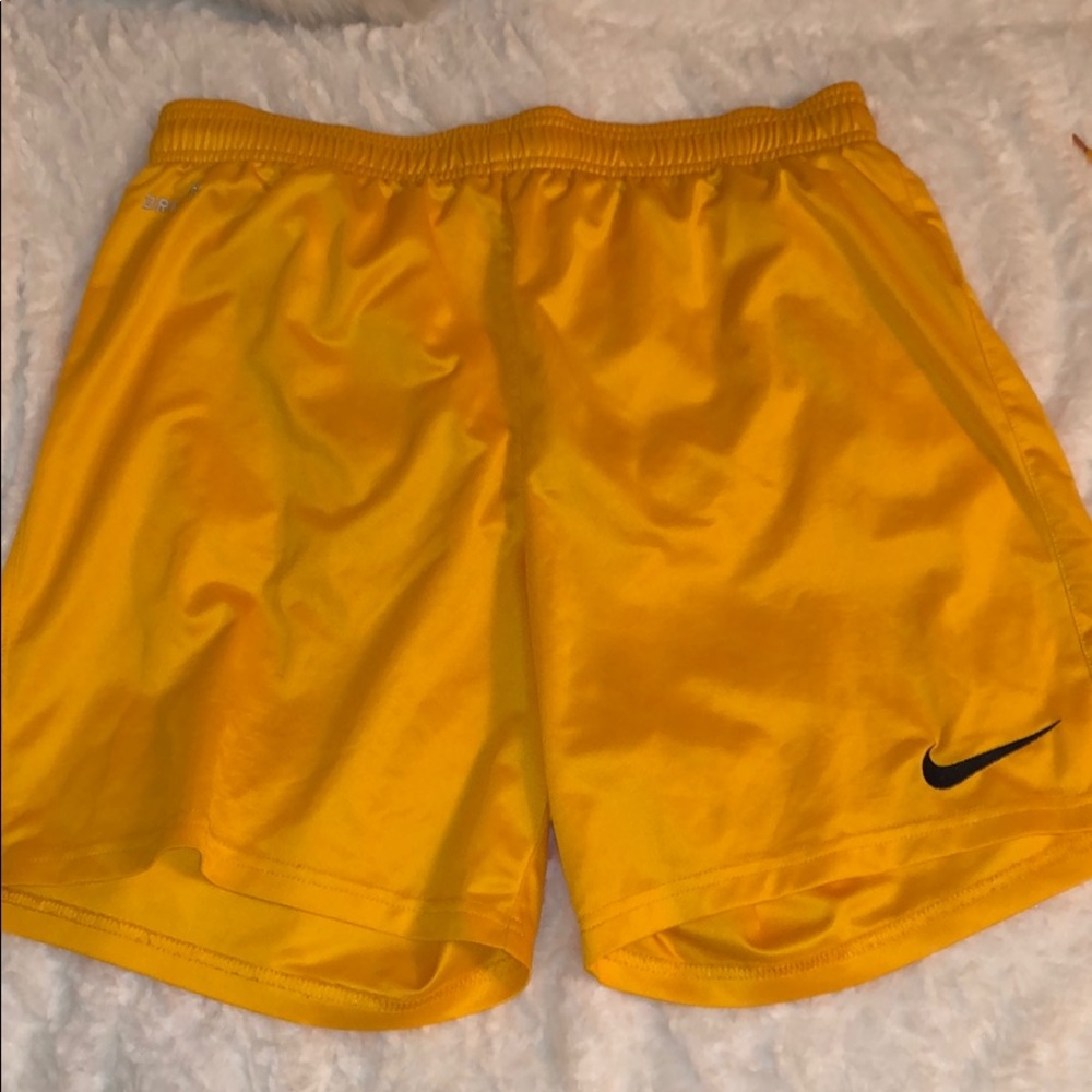 Yellow Nike athletic shorts